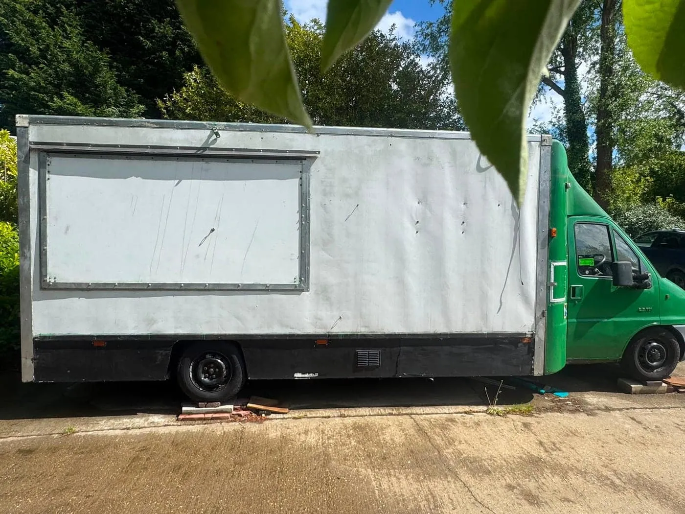 The van stripped back and primed in white, ready for wrapping