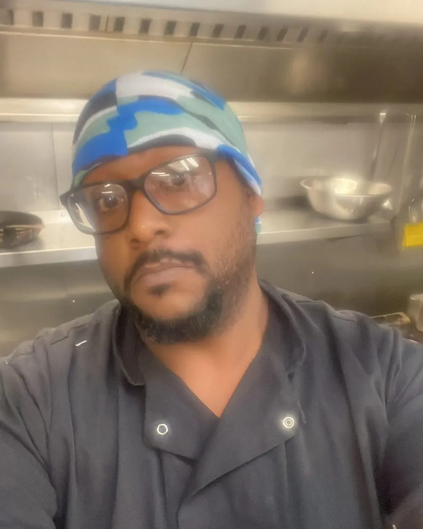Mikhail James, founder of Mae-Jah Munch, in the kitchen